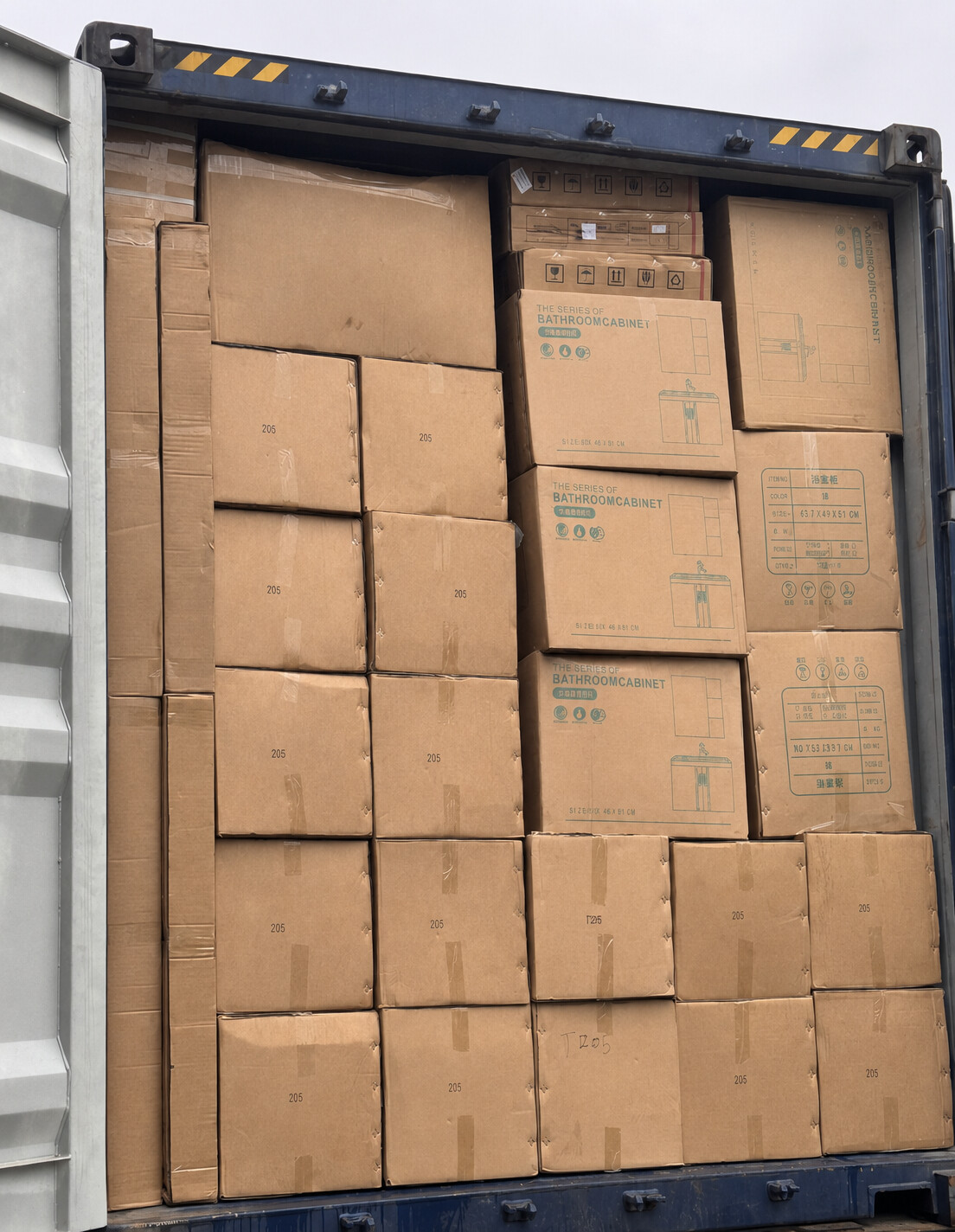 Bathroom product cartons loaded into an export container